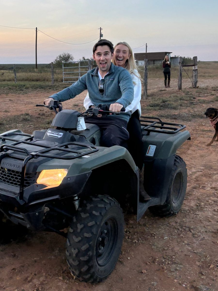 Paul and his fiancée Alana on a four-wheeler at sunset